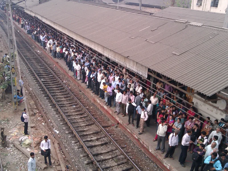 Thane red light area, Mumbai — rush-hour crowds packed along the Thane station platform